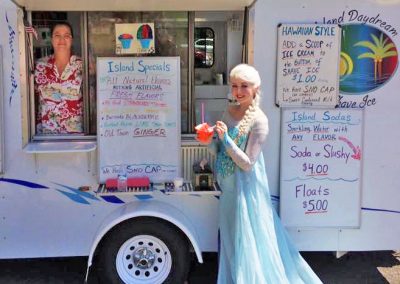 princess in front of shave ice trailer